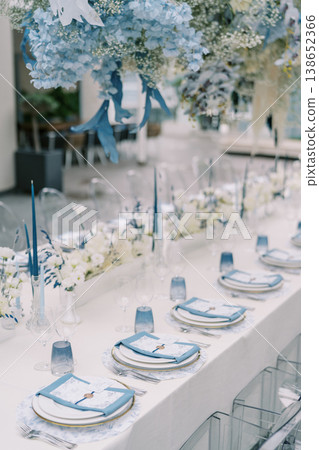 Elegant Floral Dining. Chic Celebration Featuring Floral Arrangements And Candlelight Elegant Floral Dining. Chic Celebration Featuring Floral Arrangements And Candlelight 138652366