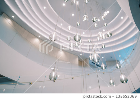 Contemporary Public Area Featuring Suspended Glass Spheres And Sleek Architectural Elements Contemporary Public Area Featuring Suspended Glass Spheres And Sleek Architectural Elements 138652369