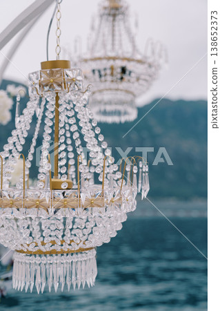 Magnificent Glass Lighting Fixtures Suspended Above Still Waters Create Aura Of Elegance And Purity Magnificent Glass Lighting Fixtures Suspended Above Still Waters Create Aura Of Elegance And Purity 138652373