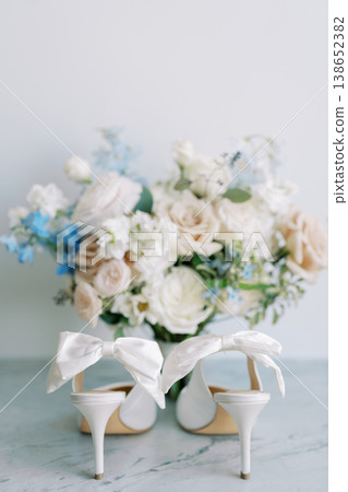 Closeup Of Bridal Accessories In Soft Neutral Tones Highlighting Ribbon And Petals Closeup Of Bridal Accessories In Soft Neutral Tones Highlighting Ribbon And Petals 138652382