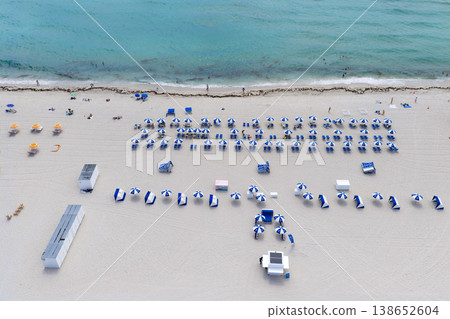 Drone aerial view of Miamis sandy beach. Miami coastline. Wide drone shot of Miami Beach and ocean waves. Miami Beach from above. Oceanfront Miami resorts by drone. Drone aerial view of Miamis sandy beach. Miami coastline. Wide drone shot of Miami Beach and ocean waves. Miami Beach from above. Oceanfront Miami resorts by drone. 138652604