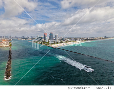 Luxury yacht cruising near Miami skyline. Aerial view of boats on turquoise waters in Miami. Yacht retreat in South Florida Miami. Miami cityscape with sailing vessels. Waterfront Miamis panorama. Luxury yacht cruising near Miami skyline. Aerial view of boats on turquoise waters in Miami. Yacht retreat in South Florida Miami. Miami cityscape with sailing vessels. Waterfront Miamis panorama. 138652715