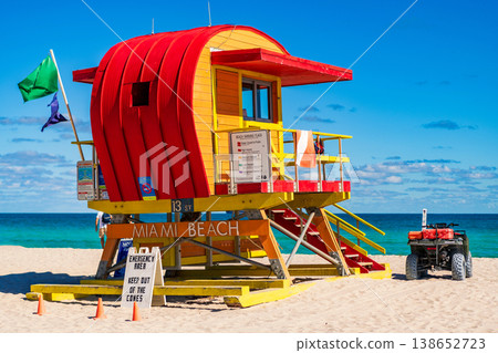 Miami pier. Jetty lifeguard tower on Miami Beach. Scenic view of Miami Beach coastline. Famous South Beach lifeguard. Tropical paradise in Miami. Art Deco lifeguard on Miamis beach. 138652723