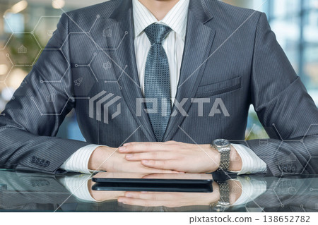 Businessman at a modern desk Businessman at a modern desk 138652782