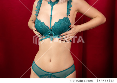 Close up of woman in green lingerie posing Close up of woman in green lingerie posing 138653158