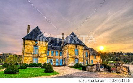 A beautiful sunset illuminates the historic stone facade and manicured gardens of the Castle of the Dukes of Bar in Bar-le-Duc, France. A beautiful sunset illuminates the historic stone facade and manicured gardens of the Castle of the Dukes of Bar in Bar-le-Duc, France. 138653196