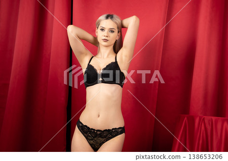 Pretty woman in black lingerie with hands in hair Pretty woman in black lingerie with hands in hair 138653206
