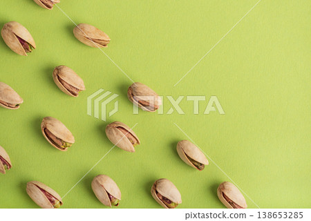 Pistachio Nuts Pattern with Copy Space on Green Background Pistachio Nuts Pattern with Copy Space on Green Background 138653285