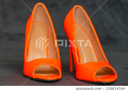 Bright orange open toe high heels stylish sexy stiletto shoes fashion footwear close up pair 138654164