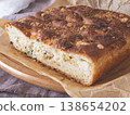 Freshly baked homemade cheesy garlic bread with a golden crispy crust resting on parchment paper. Cozy meal concept 138654202