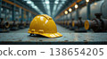 Yellow safety helmet in modern industrial factory interior 138654205