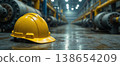 Yellow safety helmet on industrial factory floor scene 138654209