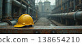 Yellow hard hat on industrial plant pipeline corridor 138654210