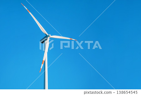 Single wind electricity power turbine against clear blue sky Single wind electricity power turbine against clear blue sky 138654545