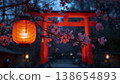 With a vermilion torii gate in the background, cherry blossom lanterns light up in the quiet twilight. 138654893