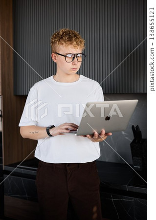 Person programming in shared modern workspace full of gadgets 138655121