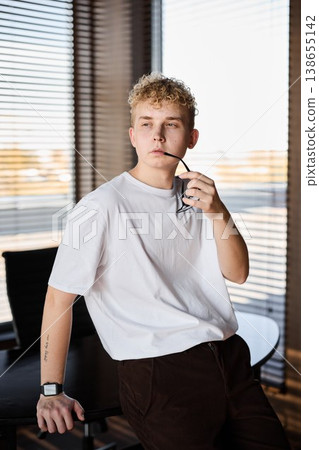Young person thinking in contemporary home office space Young person thinking in contemporary home office space 138655142