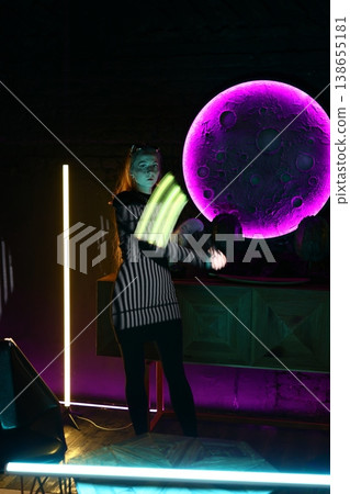 Business executive in pinstripe attire beneath neon glow at night 138655181