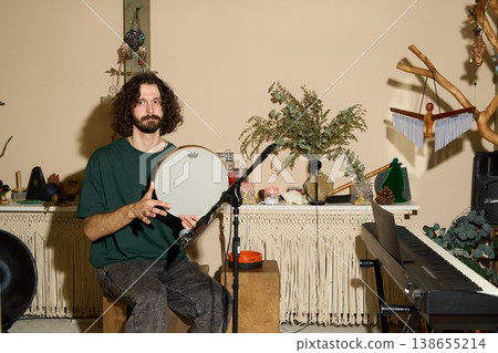 Creative musician recording soulful rhythms at home with vintage equipment Creative musician recording soulful rhythms at home with vintage equipment 138655214