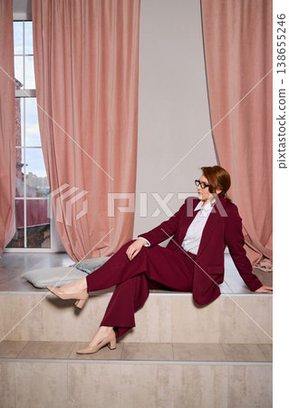 Elegant Caucasian woman providing friendly guidance at window Elegant Caucasian woman providing friendly guidance at window 138655246