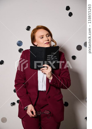 Serene portrait of woman with glasses and polka dot background Serene portrait of woman with glasses and polka dot background 138655263