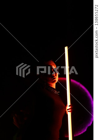 Peaceful setting revealing clandestine actions illuminated by neon lights 138655272