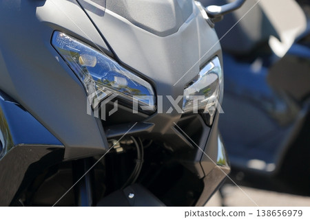 Image of a big scooter's headlight. Image of a big scooter's headlight. 138656979