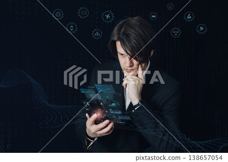 A businessman deep in thought, manipulating the network with his smartphone, symbolizing IoT and smart living. 138657054