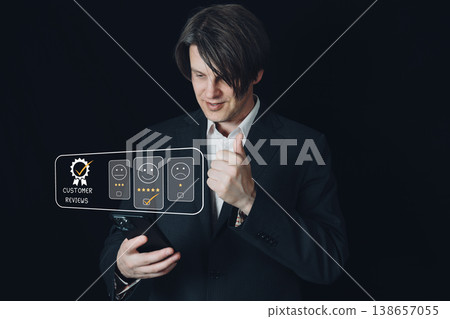 A businessman gives a thumbs-up in front of a customer review hologram, indicating his satisfaction. 138657055