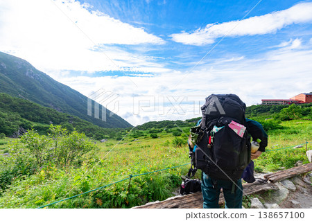 Hikers enjoying the hiking trails and spectacular views of Senjojiki Cirque 138657100
