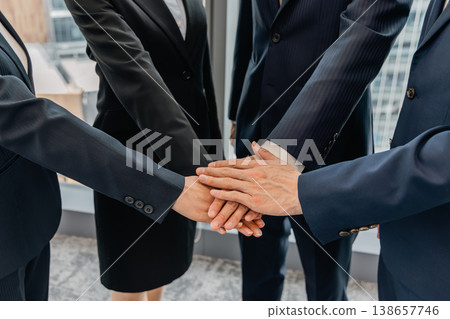 Circle formation, hands clasped together, business image Circle formation, hands clasped together, business image 138657746
