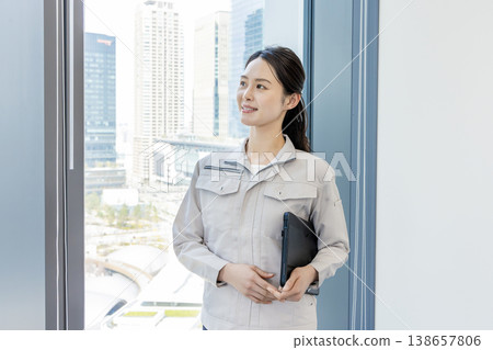 Woman in work clothes Woman in work clothes 138657806