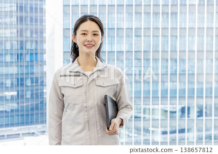 Woman in work clothes 138657812