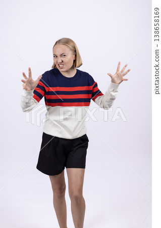Young woman showing fear and anxiety with hands up Young woman showing fear and anxiety with hands up 138658169