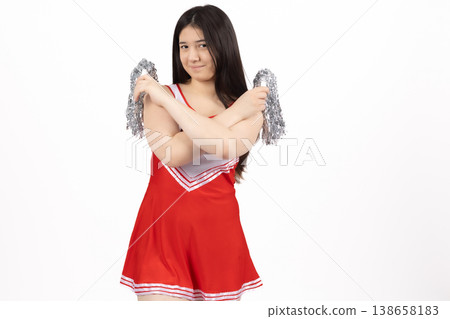 Woman in red outfit with white wings hugging herself Woman in red outfit with white wings hugging herself 138658183