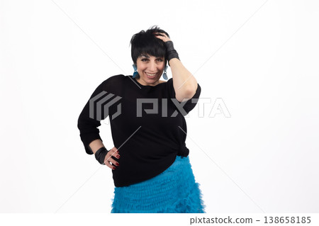 Confident woman in black clothes posing with hand on head Confident woman in black clothes posing with hand on head 138658185