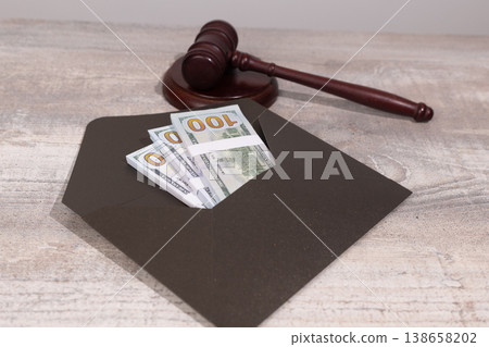 Legal gavel on table with money and american flag Legal gavel on table with money and american flag 138658202