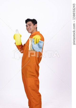 Maintenance worker in orange jumpsuit holding a coffee cup Maintenance worker in orange jumpsuit holding a coffee cup 138658243
