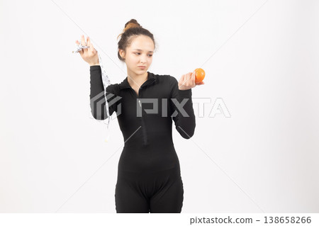 Healthy woman holding fresh oranges near face Healthy woman holding fresh oranges near face 138658266