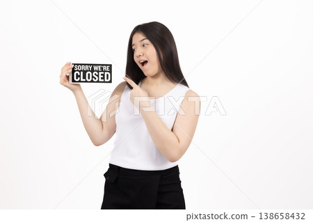 Excited woman holding a sign board with open mouth Excited woman holding a sign board with open mouth 138658432