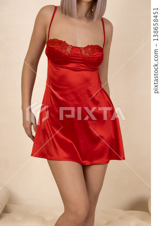 Full length of woman in red nightgown in studio Full length of woman in red nightgown in studio 138658451