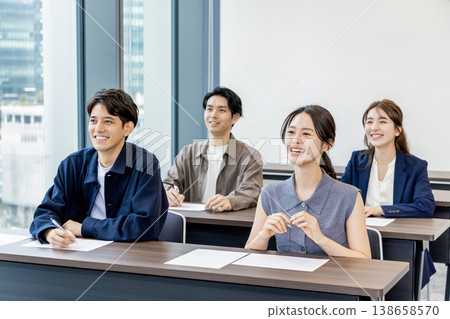 Men and women participating in seminars and classes Men and women participating in seminars and classes 138658570