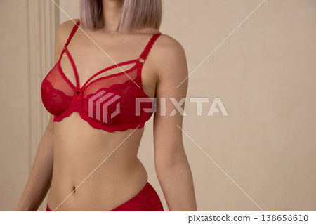 Close up of woman in red lace lingerie posing Close up of woman in red lace lingerie posing 138658610