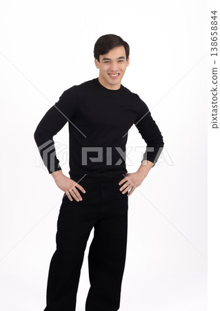 Confident man in black outfit posing for a portrait 138658844