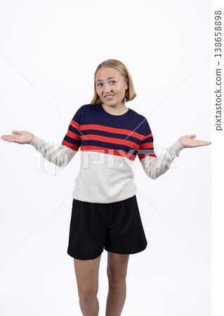 Surprised woman shrugging with hands out Surprised woman shrugging with hands out 138658898