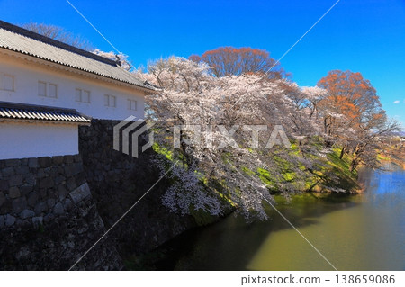 Blue sky and cherry blossoms at Kajo Park, Yamagata Castle Ruins, Ninomaru East Main Gate and Main Bridge Blue sky and cherry blossoms at Kajo Park, Yamagata Castle Ruins, Ninomaru East Main Gate and Main Bridge 138659086