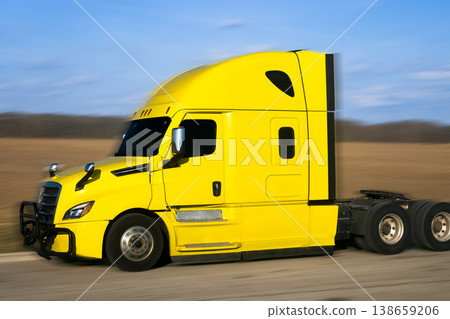 Detailed side profile of a yellow truck cabin on a spring field Detailed side profile of a yellow truck cabin on a spring field 138659206