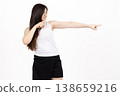 Woman pulling an invisible rope in a studio setting 138659216