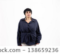 Portrait of a woman in a navy shirt looking at camera 138659236