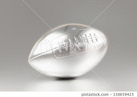 Metallic silver american football ball on clean grey background Metallic silver american football ball on clean grey background 138659423